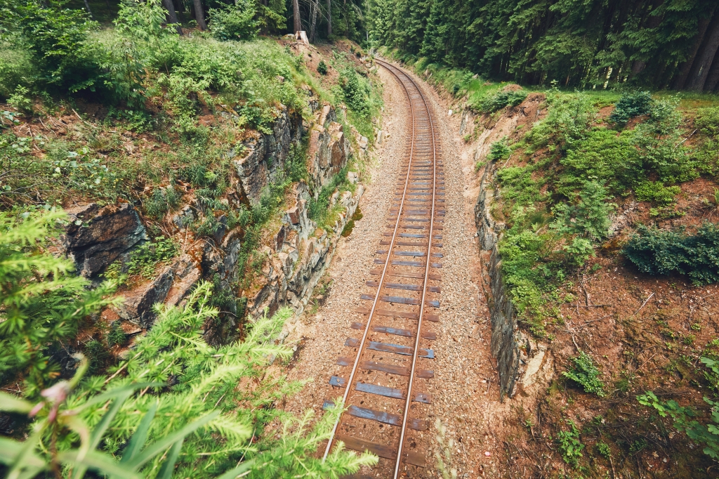 Old railroad track in the middle of the deep forest. Ore Mountains, Czech Republic